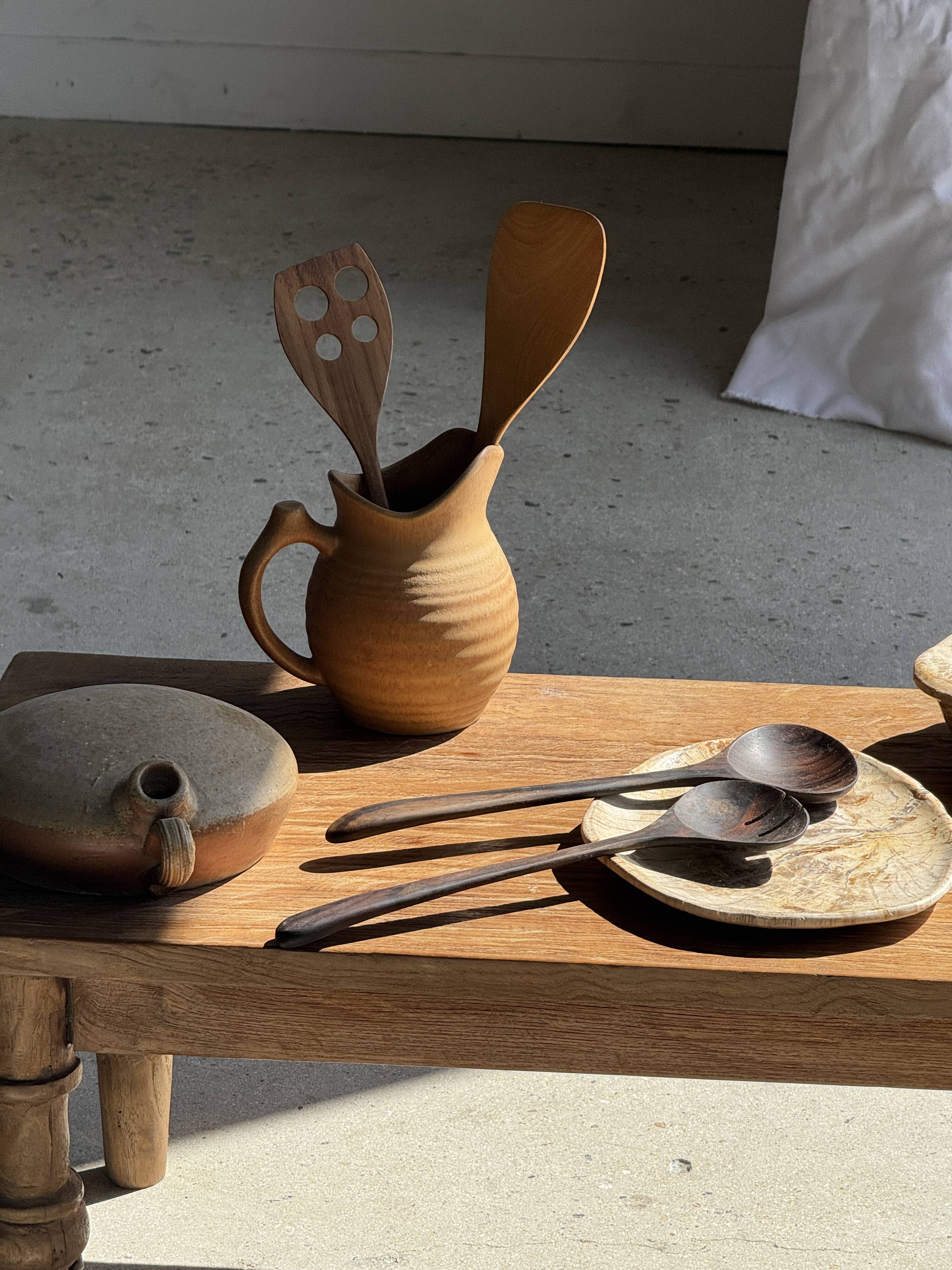 Pair of salad servers or kitchen utensils in blackened teak L30 D9