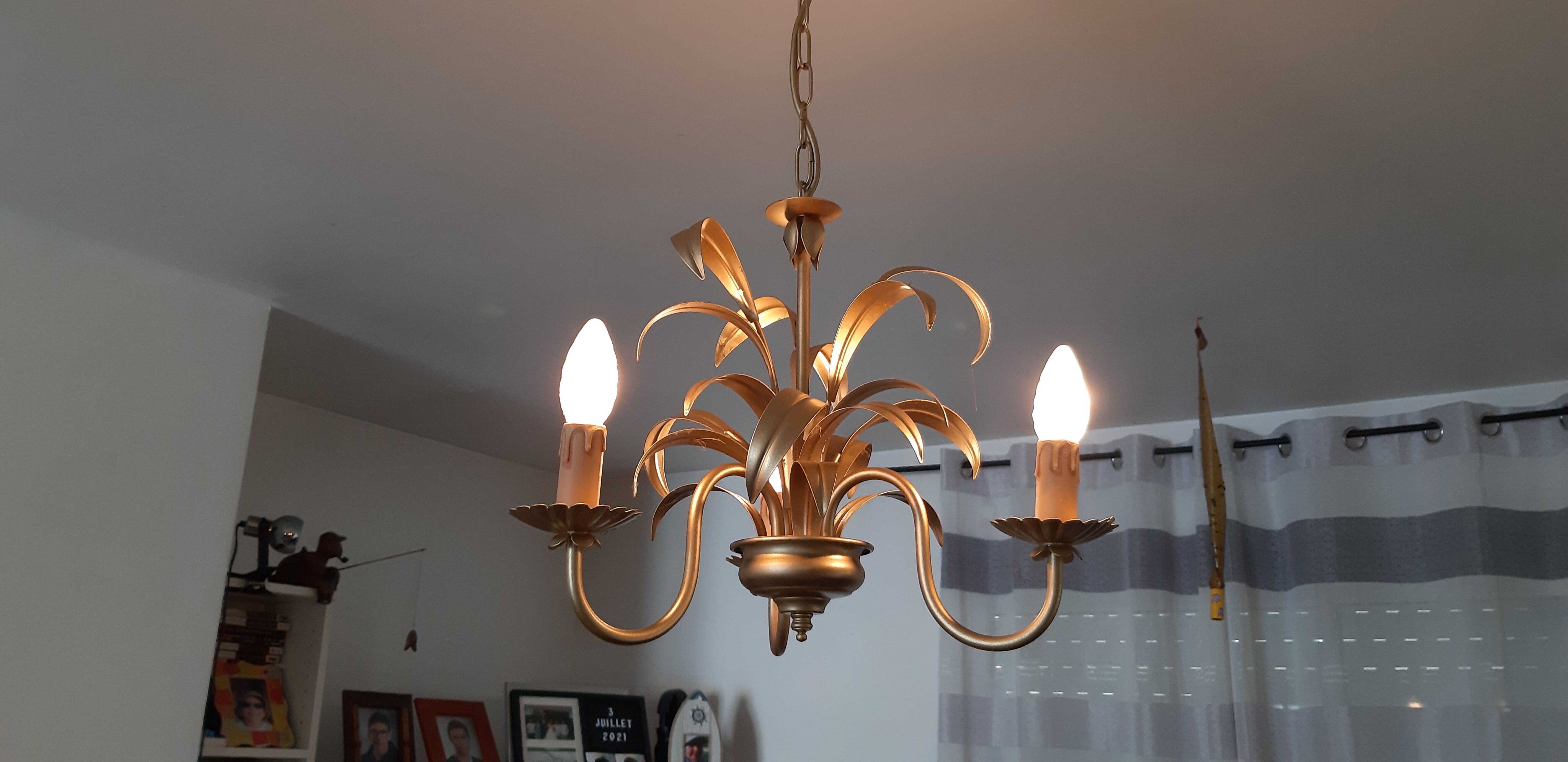 Vintage chandelier in golden metal