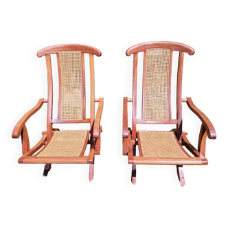 Pair of teak and canned deckchairs