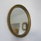 Old oval mirror in gilded wood 50s 60s