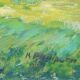 Impressionist painting of a garden with buildings in the background.