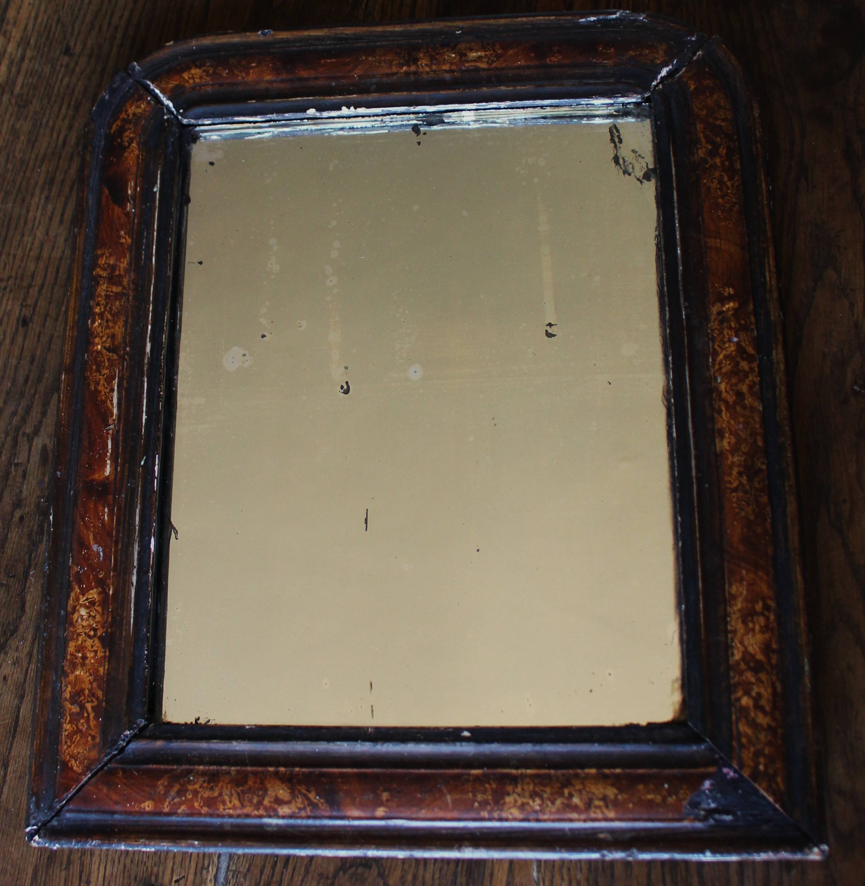 Antique Louis Philippe mirror in black and brown.