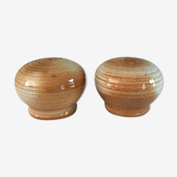 Vintage salt and pepper shaker in sandstone