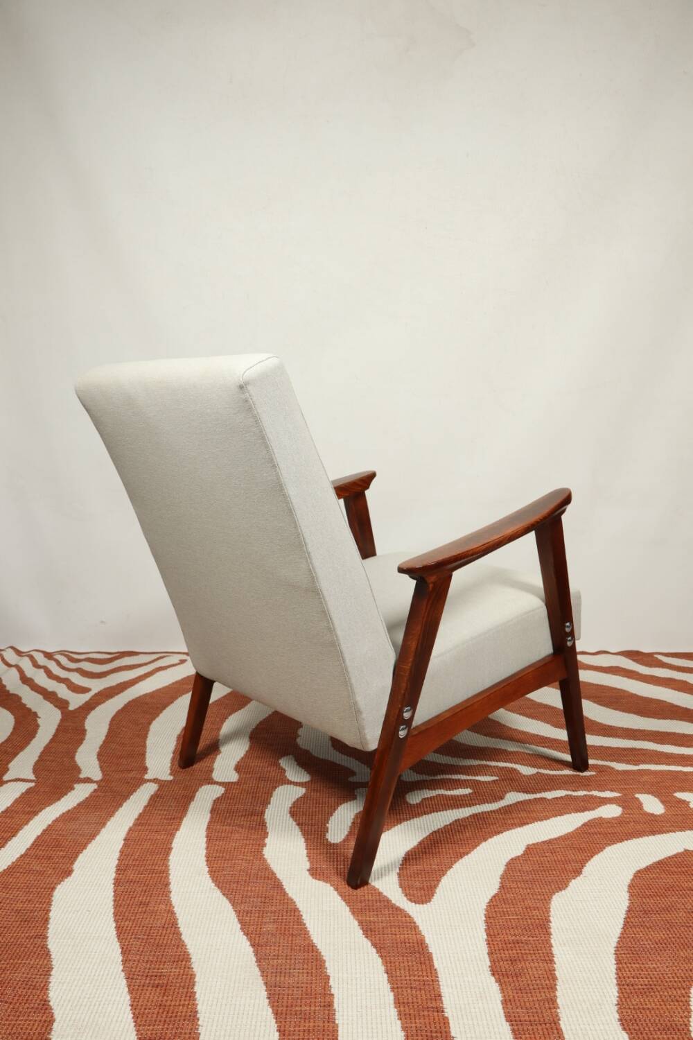 Vintage light gray armchair dark wood Scandinavian design 1970