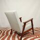 Vintage light gray armchair dark wood Scandinavian design 1970