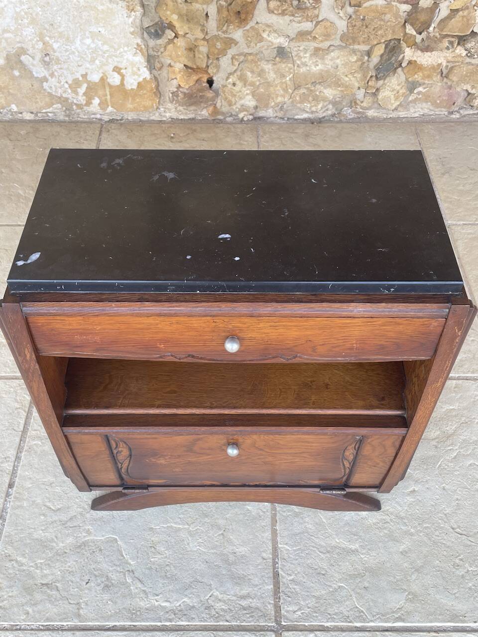 Art Deco bedside table in walnut, black marble top, circa 1920.
