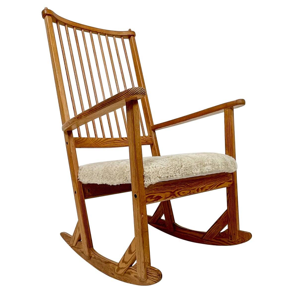 Mid-century rocking chair in pine and sheepskin by Yngve Ekström, Sweden.