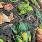 Plat en barbotine décor de coquillages et de lézard Palissy