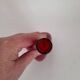 Triangular red glass vase by Gunnar Ander for Elme Glasbrück.