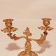 Old candle holder in gilded bronze