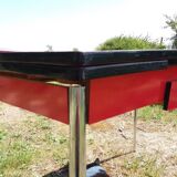 Dining table with red formica extensions