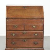 Antique English oak secretary from the 18th century with a stepped interior