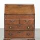 Antique English oak secretary from the 18th century with a stepped interior