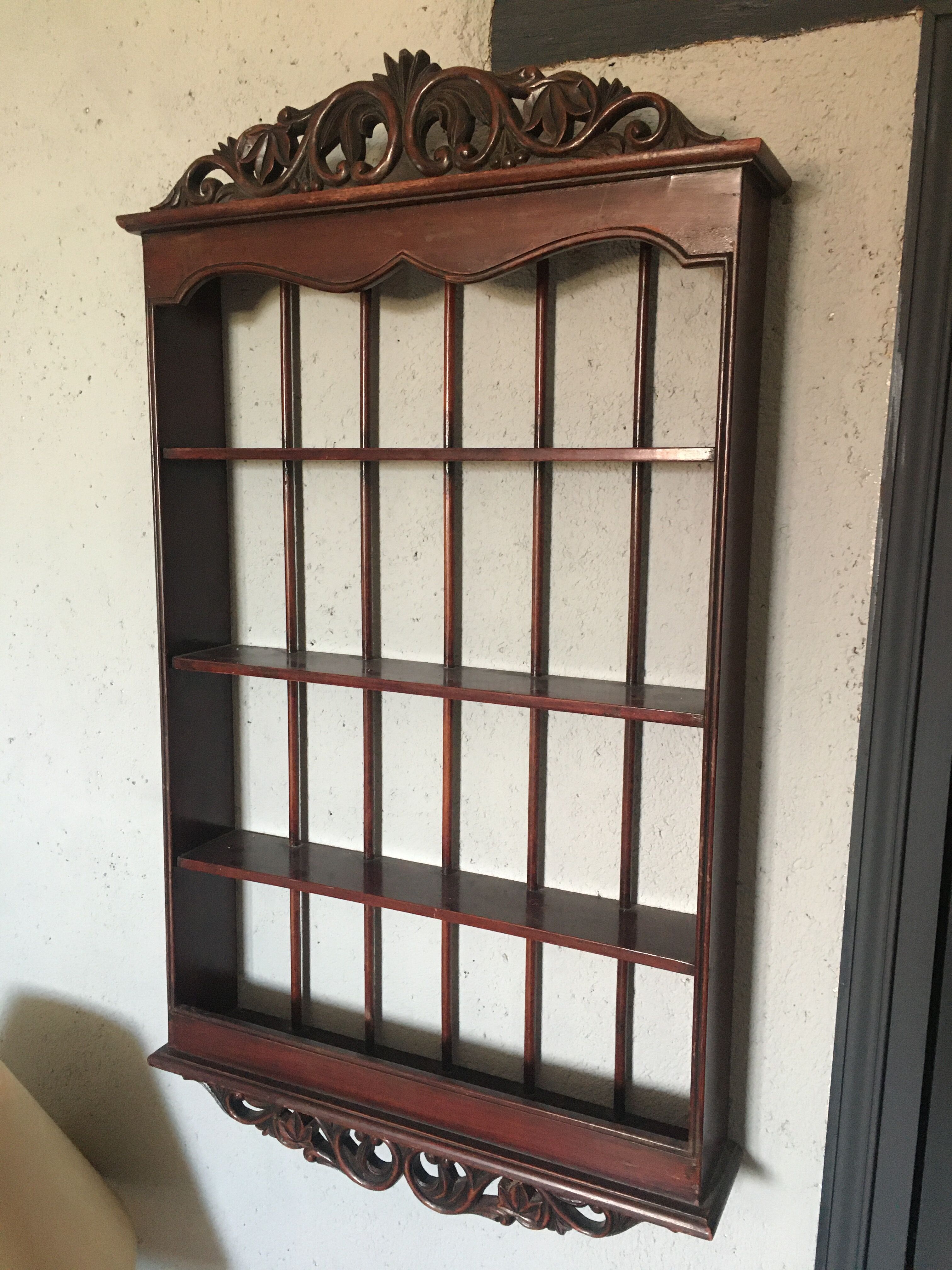 Carved wooden wall shelf for collection or other.