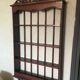 Carved wooden wall shelf for collection or other.