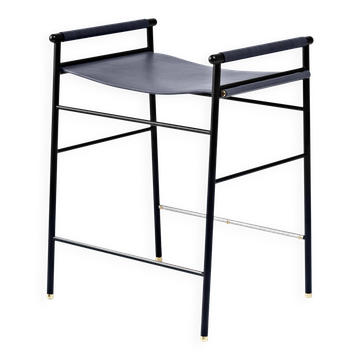 Contemporary artisan bar stool in navy blue leather and black rubber metal.