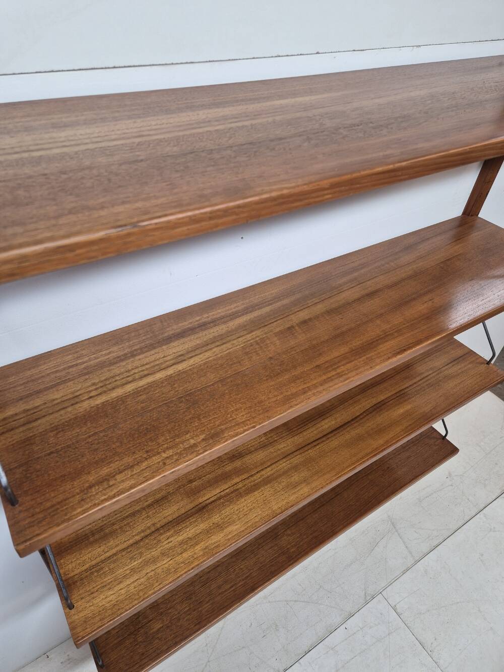 Teak shelving system, marked made in Denmark, 1960.