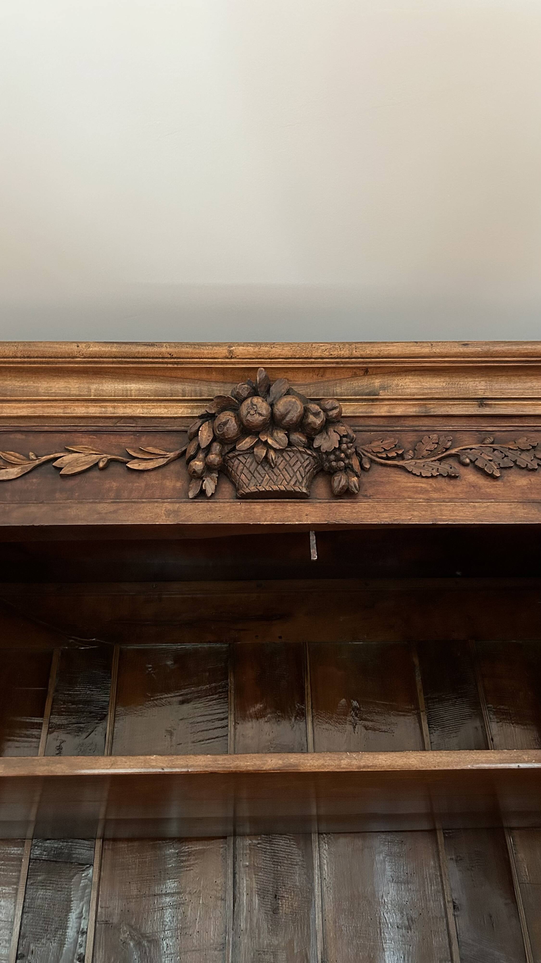 Antique walnut armoire with two doors.