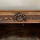 Antique walnut armoire with two doors.