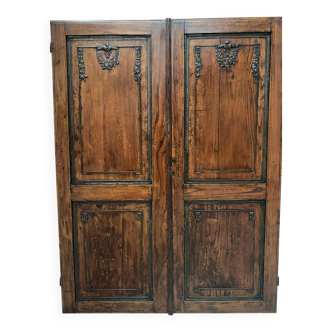 Double cupboard doors in carved oak, 20th century
