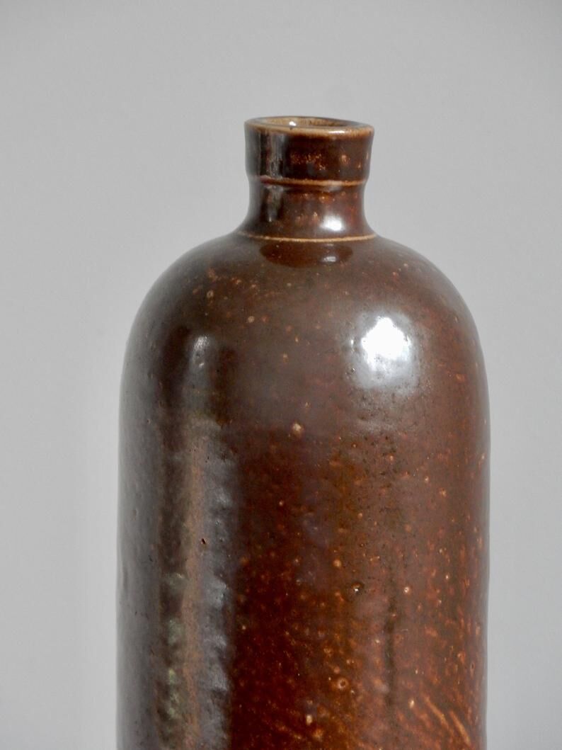 Enamelled brown sandstone bottle with handle