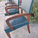 pair of dark green bridge armchairs