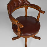 Swivel Chesterfield armchair in wood and leather