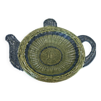 Rattan basket in the shape of a teapot.