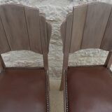 Two restyled leather-style chairs with nails