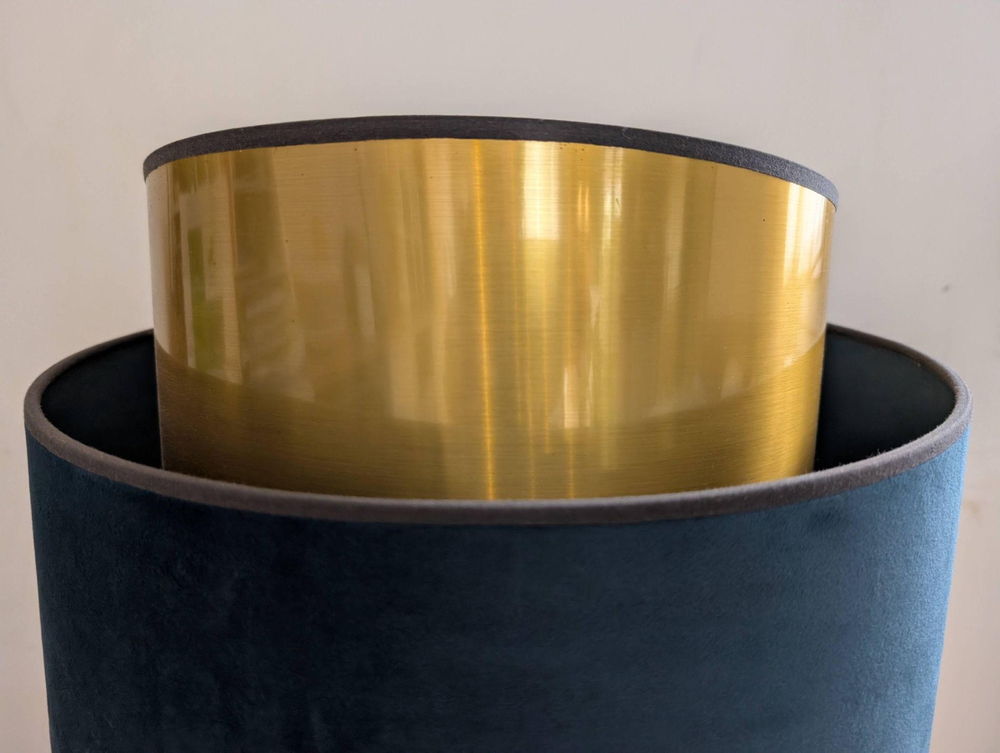 Brass lamp with asymmetrical velvet shade