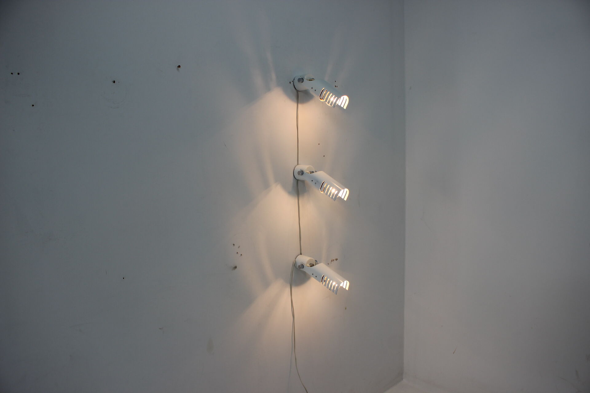 Set of three white adjustable design wall lamp, 1980's.