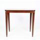 Side table decorated with bronze ornaments in light mahogany