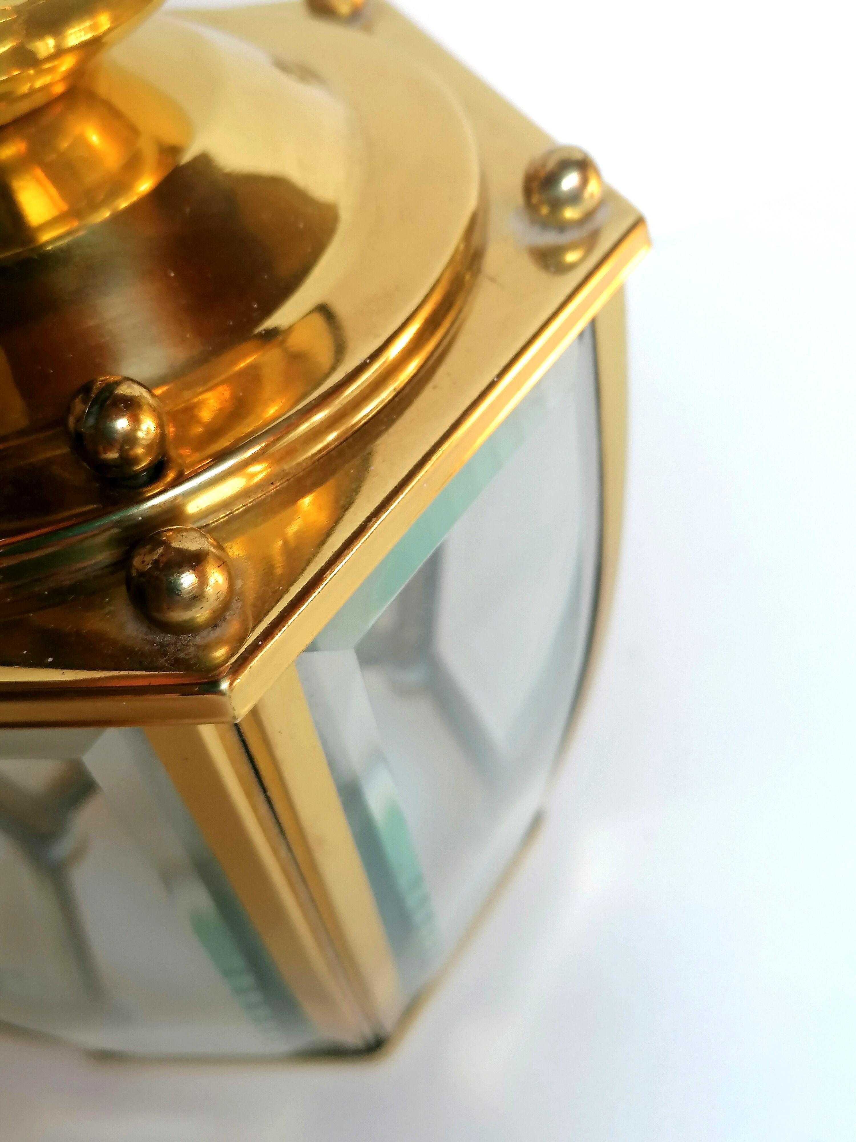 Golden hanging lamp with bevelled glasses