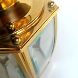 Golden hanging lamp with bevelled glasses