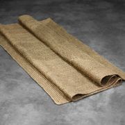 Brown flat-woven jute Indian rug, 1970.