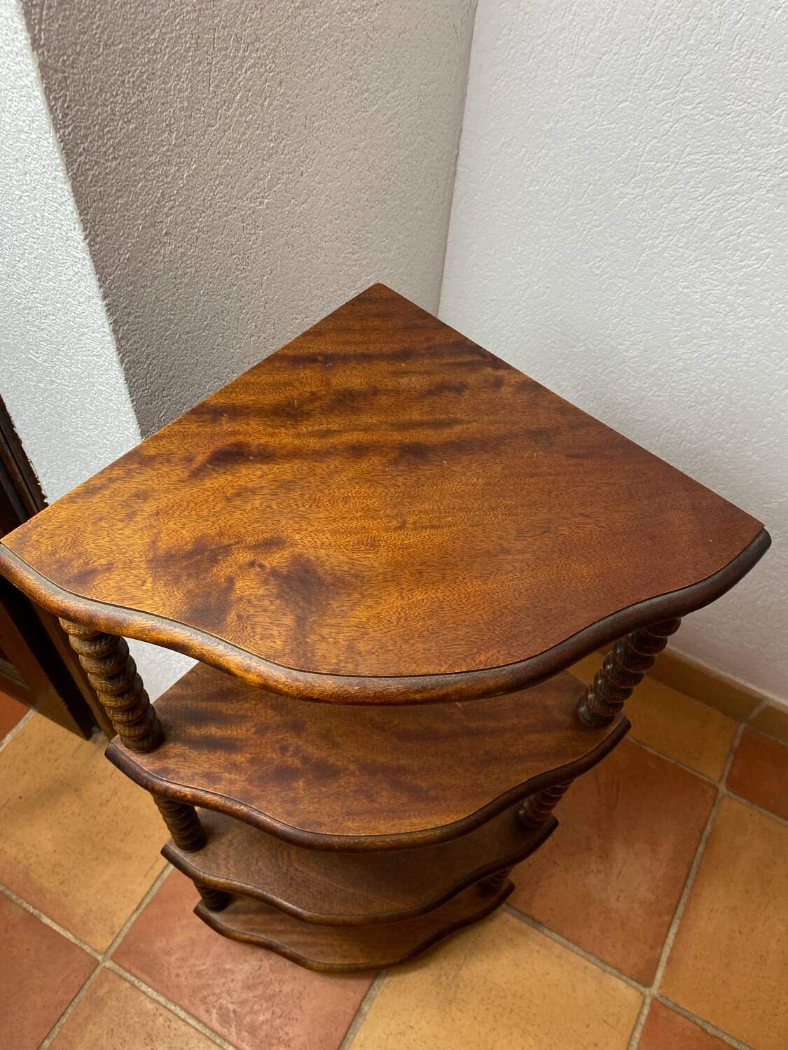 Corner shelf on a turned wooden stand