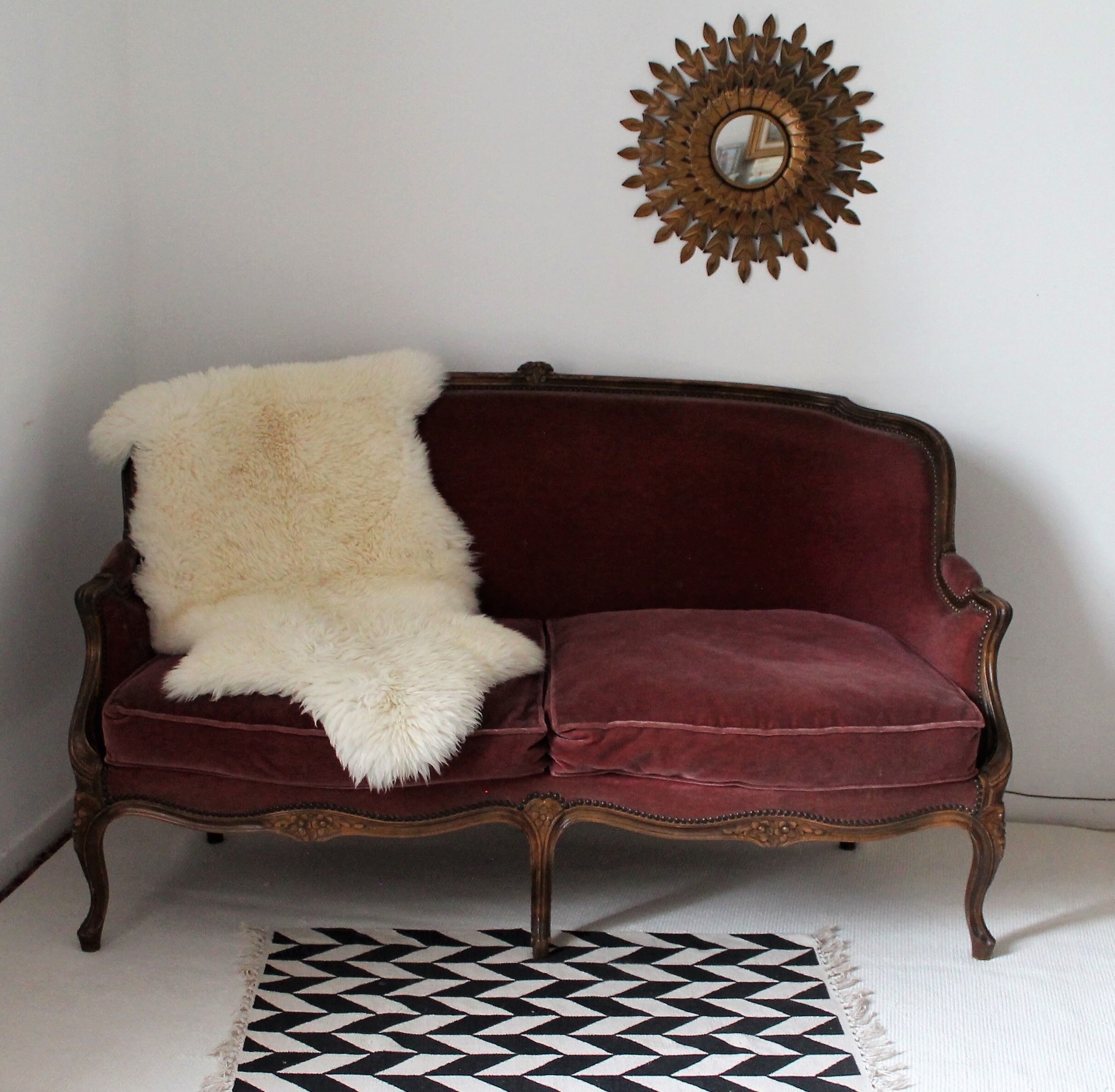 Faded pink velvet sofa