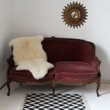 Faded pink velvet sofa