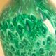 White multi-layer blown glass bottle vase with blue and green inclusions