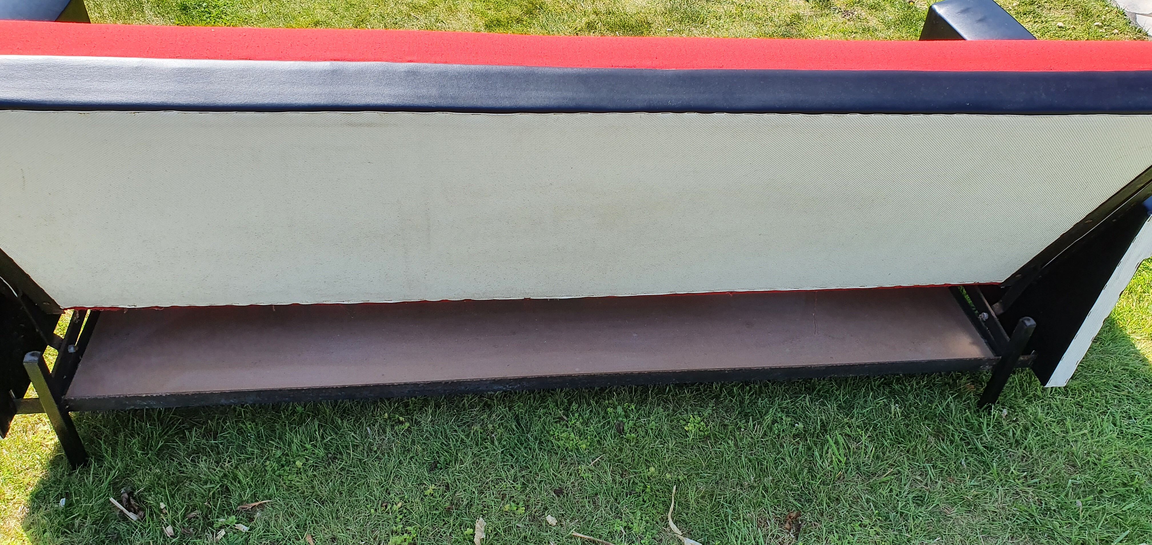 Vintage sofa 3 places convertible, red fabric and black skaï.1960s.