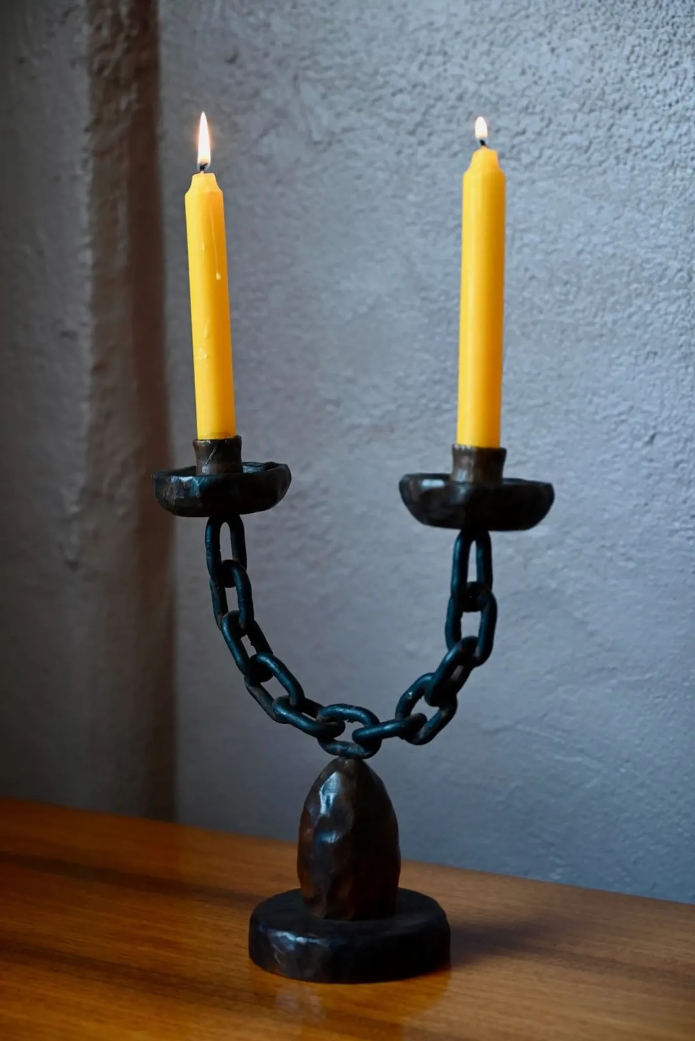 Sculpted wooden and wrought iron brutalist double chandelier from the 1960s.