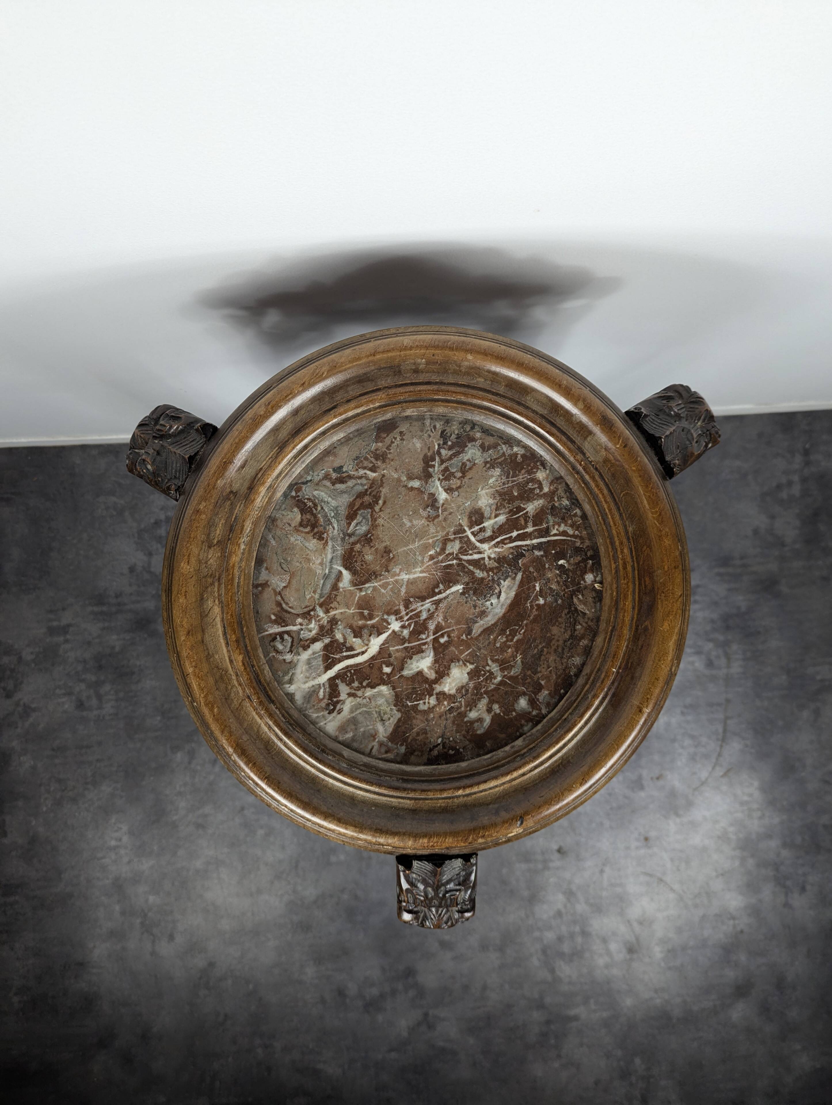 Carved selette with chimera decoration