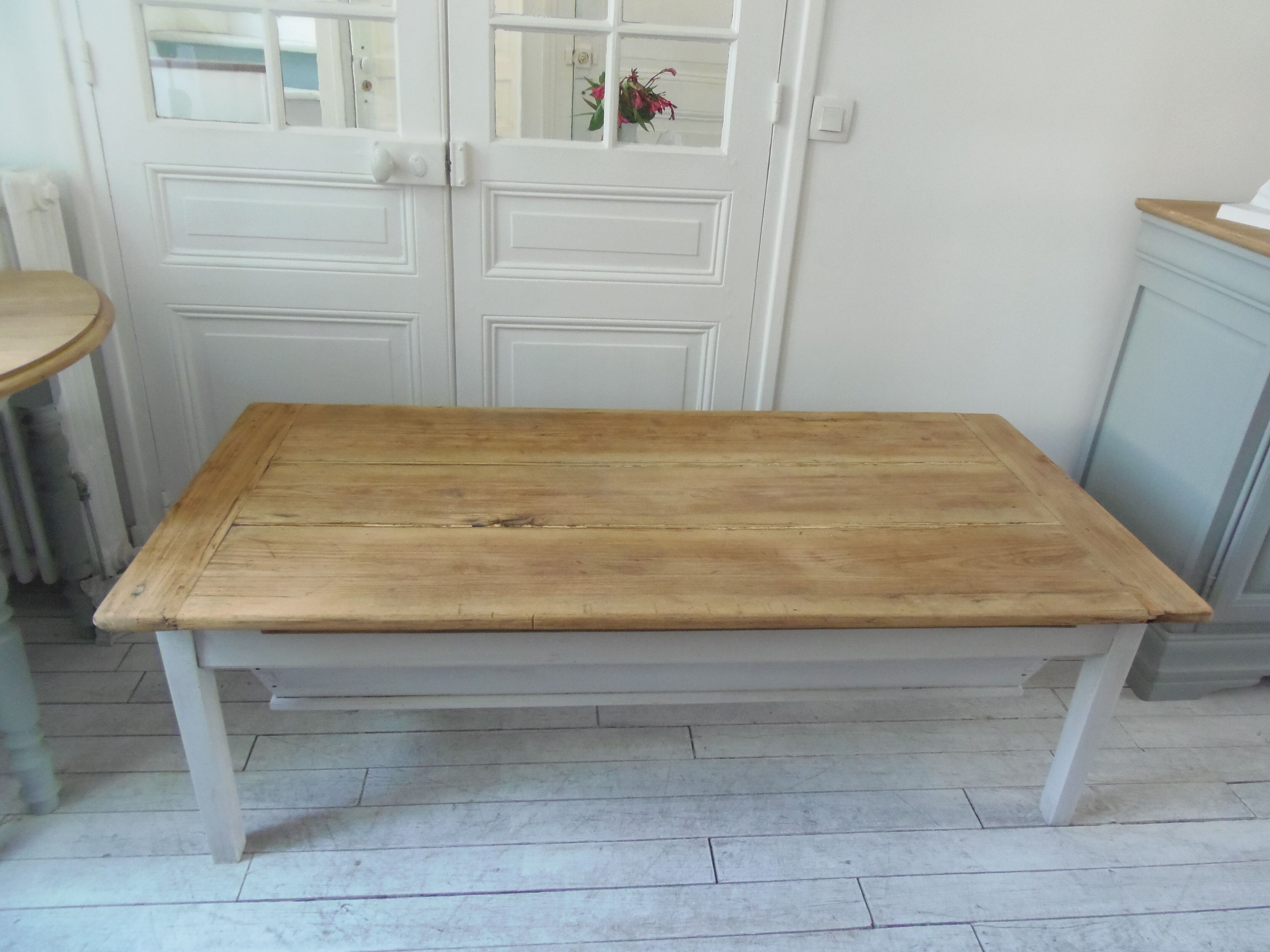 Coffee table made from an authentic farmhouse table, leg patinated pearl gray