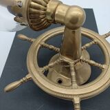 Brass wall sconces with nautical decor