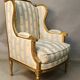 Bergère à oreilles de style louis xvi en bois doré