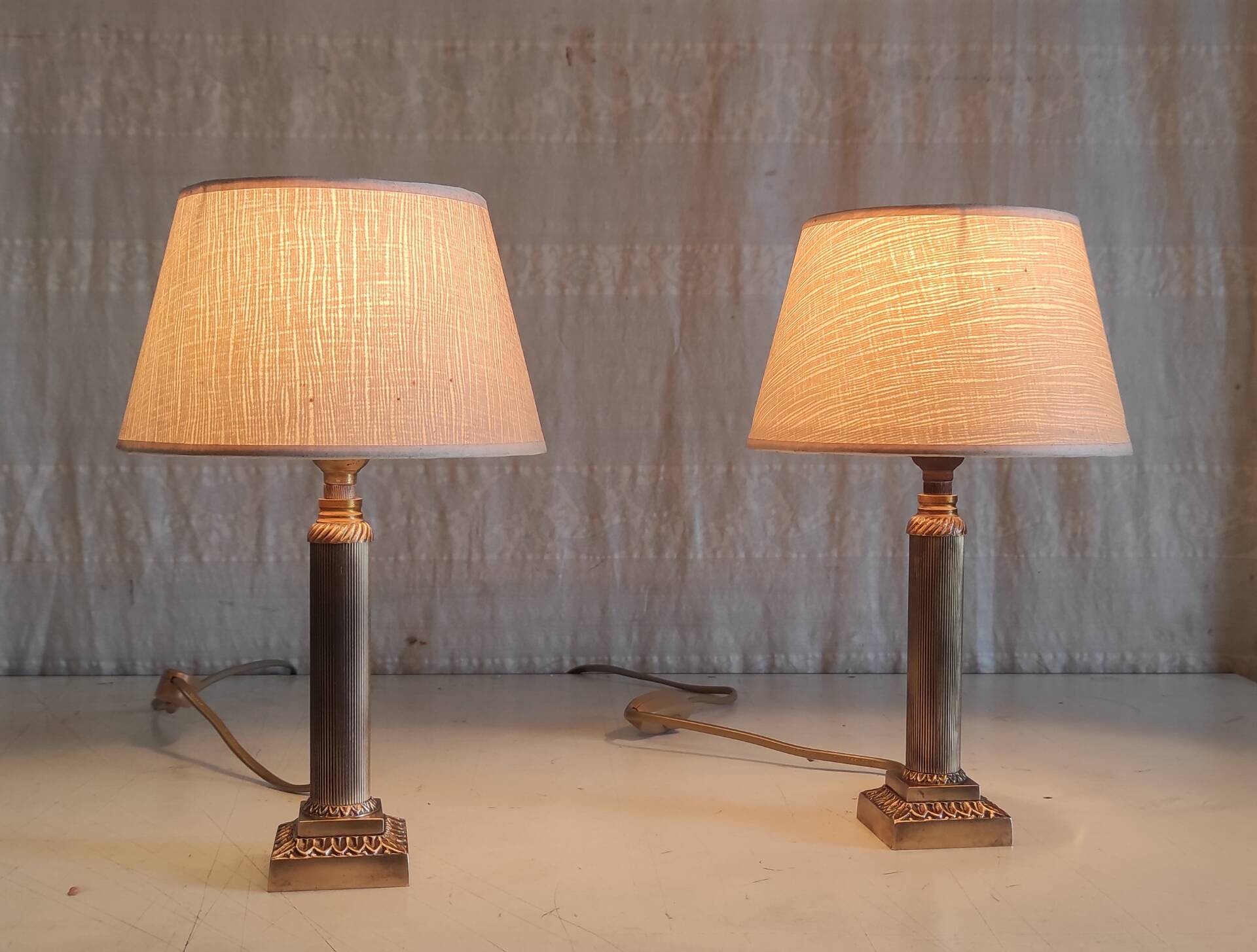 Table lamps in gilded brass with paper shades - mid 20th century.