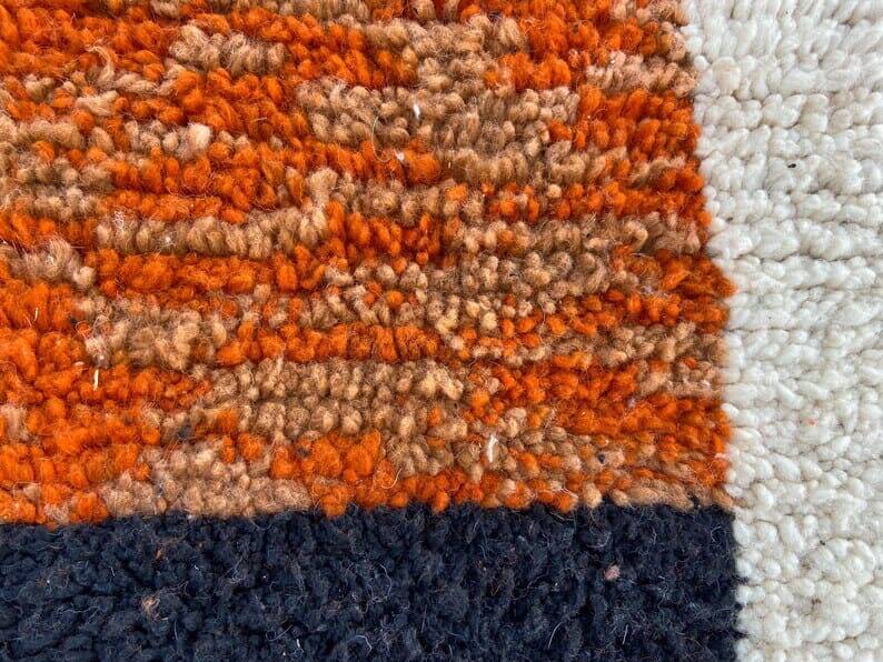 Handmade wool rug in colourful patterns, size 150x250 cm.