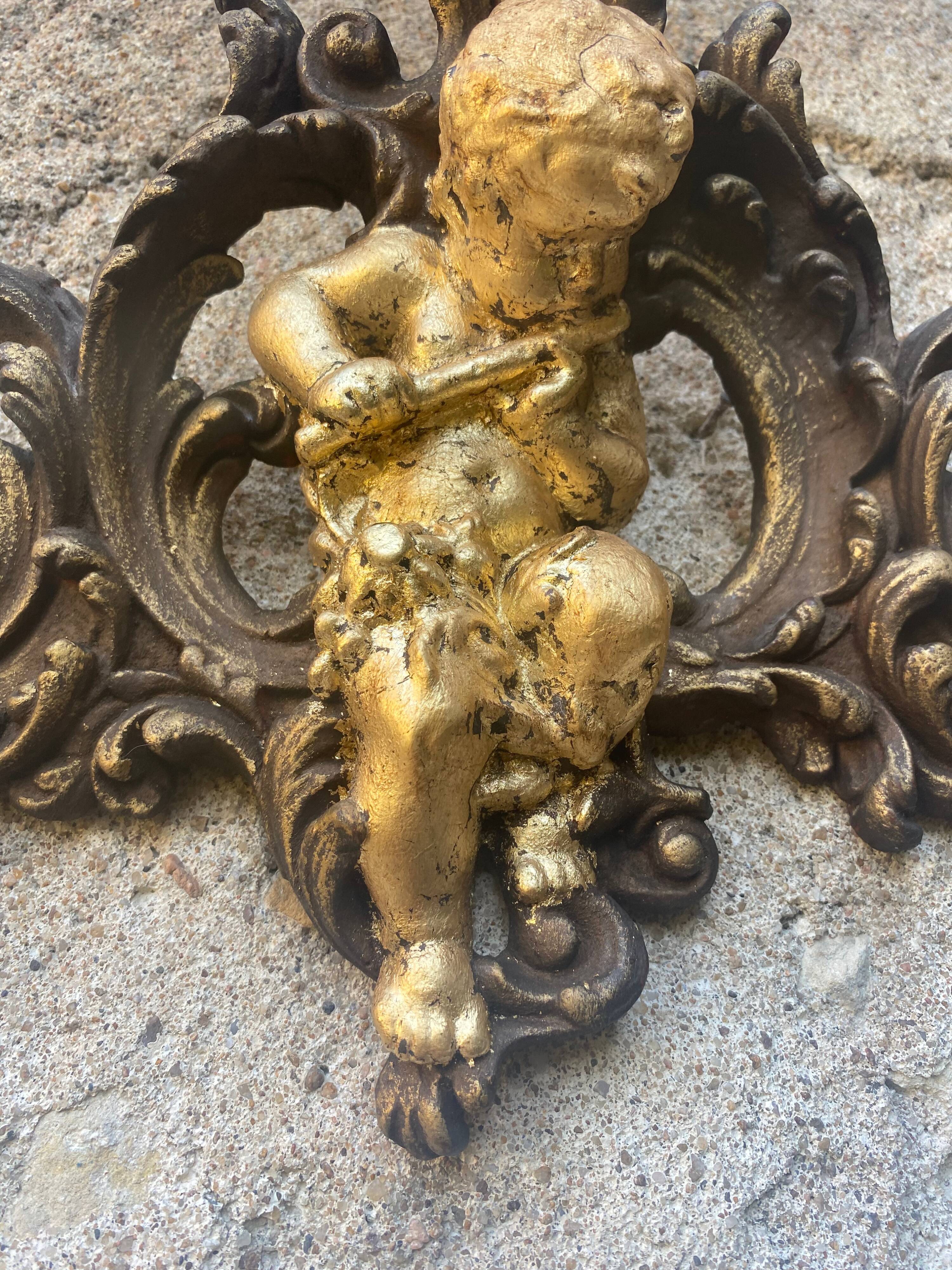 Pediment cherub musician