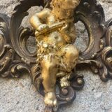 Pediment cherub musician