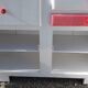 White mado buffet, red handles and tray, hen grill